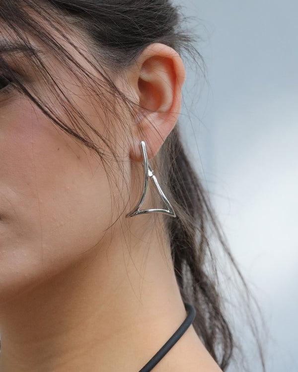 triangular earrings.