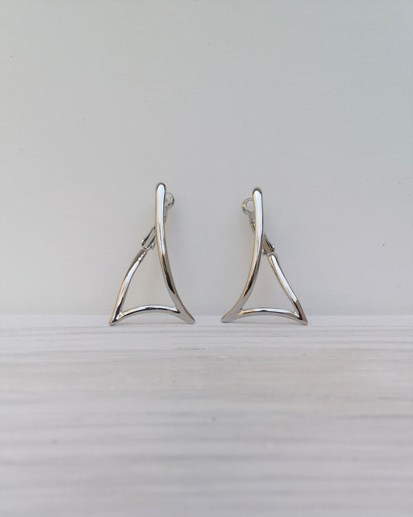 triangular earrings.